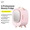 Pink beauty fridge with makeup mirror on a white background