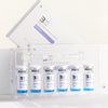 Set of medical vials with a clear plastic case on a white background